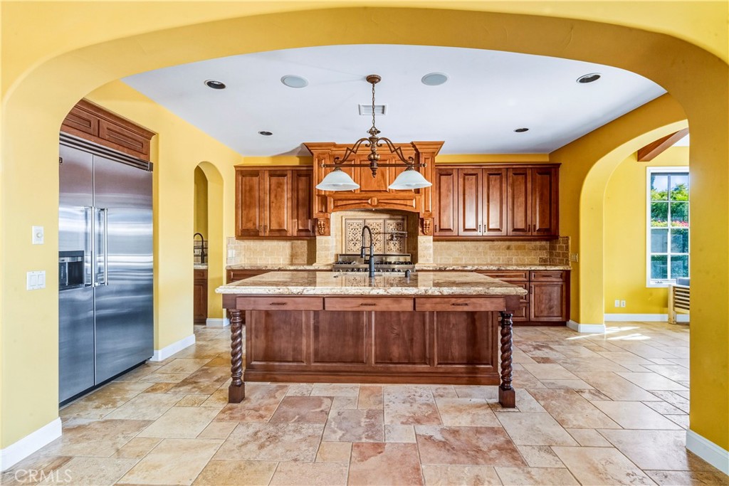 13 Cassis Circle Rancho Mirage, CA 92270 - Photo 17 of 70 a large kitchen with stainless steel appliances granite countertop a stove and a refrigerator