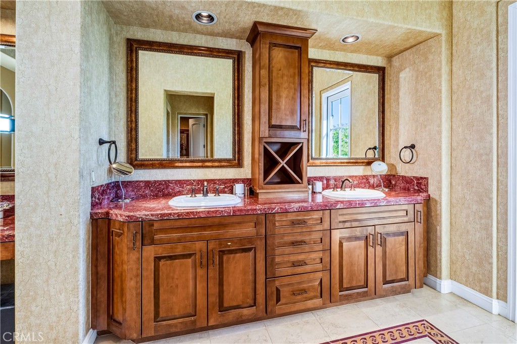 13 Cassis Circle Rancho Mirage, CA 92270 - Photo 21 of 51 a view of a bathroom with a sink and mirror