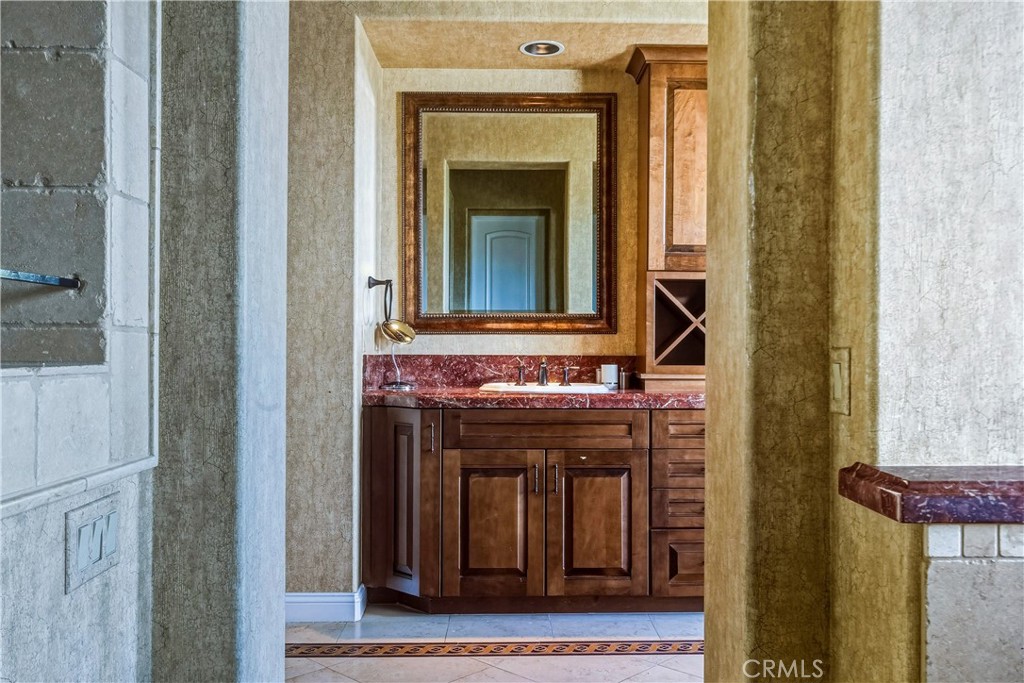 13 Cassis Circle Rancho Mirage, CA 92270 - Photo 33 of 70 a bathroom with a sink and a mirror