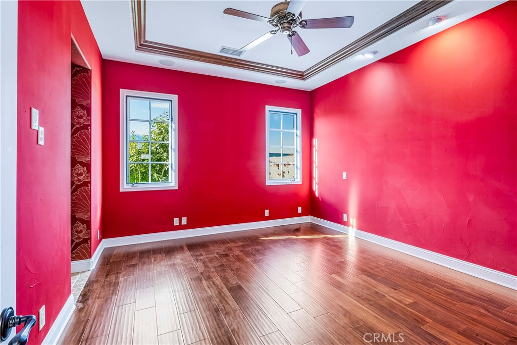 13 Cassis Circle Rancho Mirage, CA 92270 - Photo 38 of 70 a view of empty room with wooden floor and fan