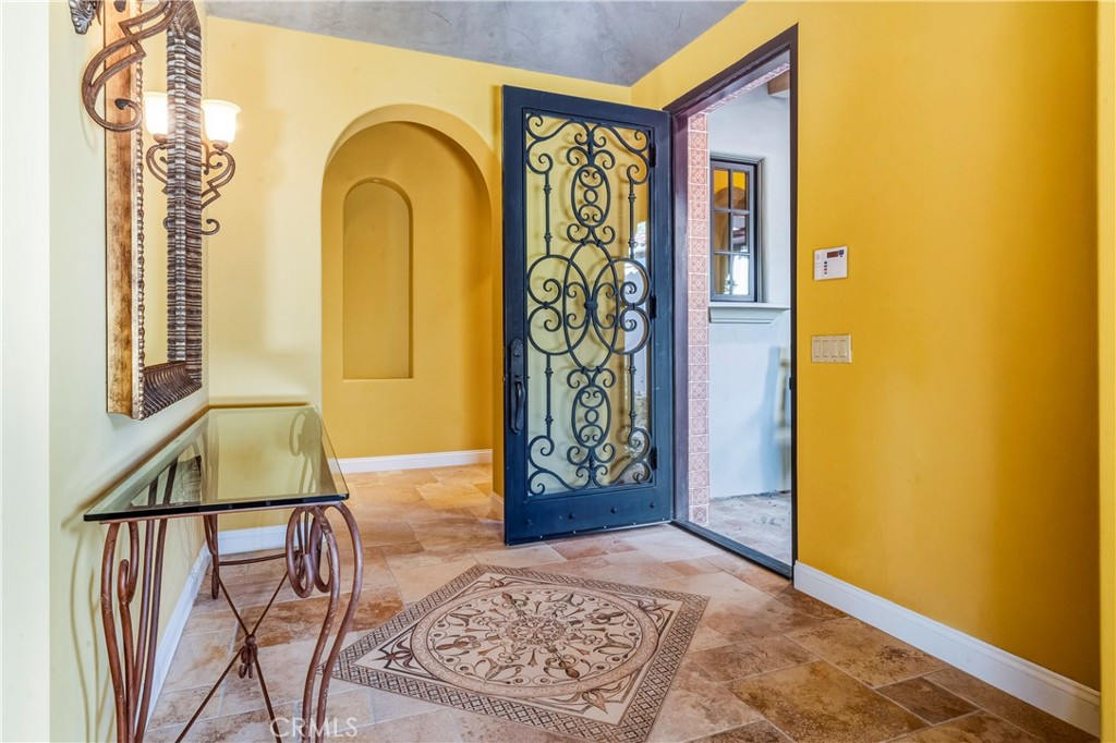 13 Cassis Circle Rancho Mirage, CA 92270 - Photo 8 of 51 a view of front door door and wooden floor