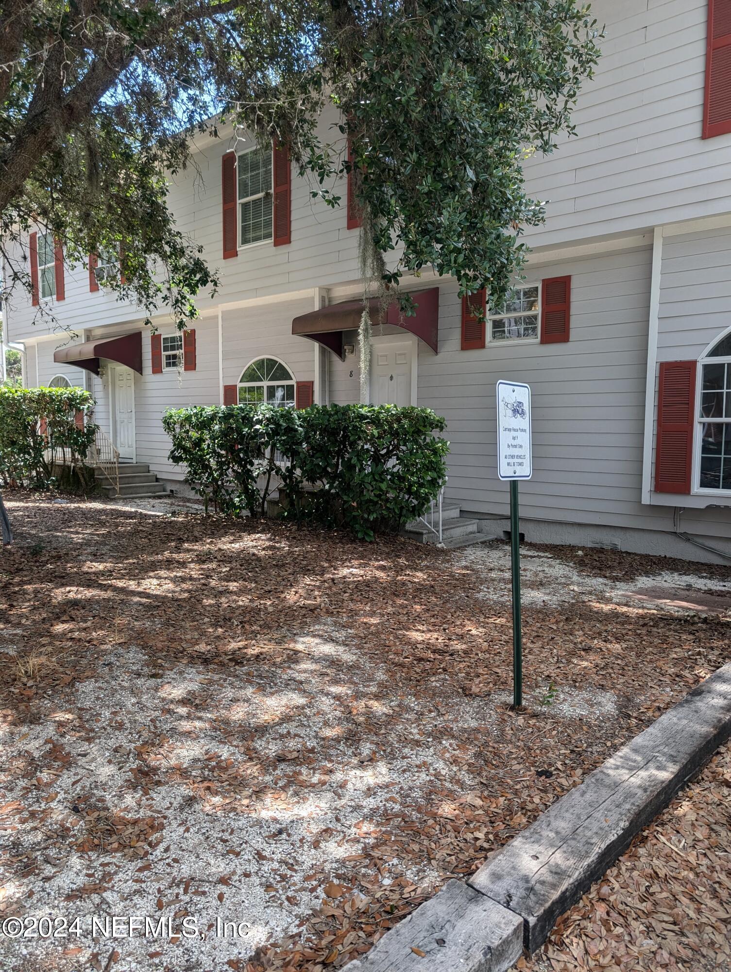 114 Cedar Street, Unit 8 St. Augustine, FL 32084 - Photo 1 of 39 a front view of a house with a yard