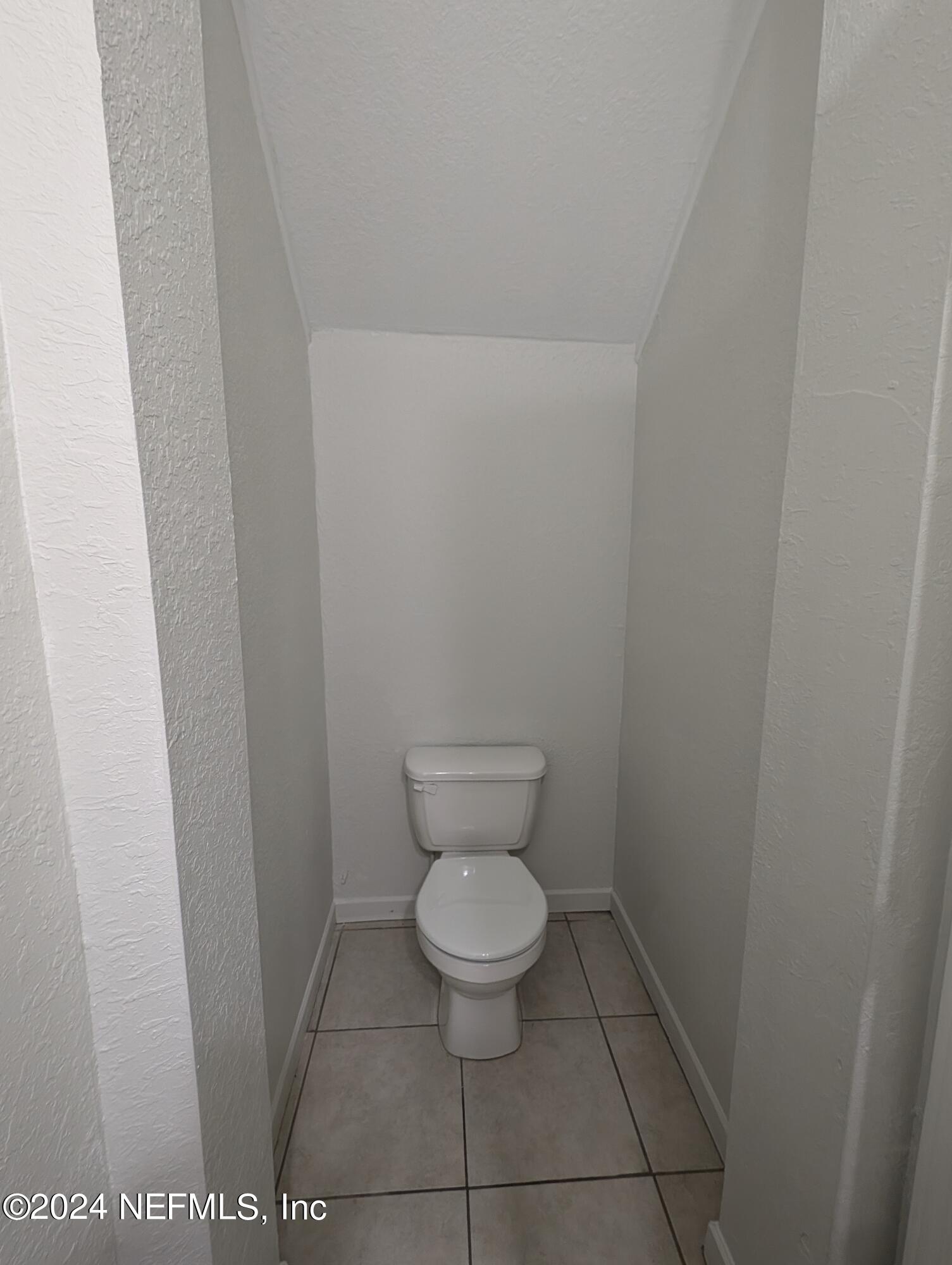 114 Cedar Street, Unit 8 St. Augustine, FL 32084 - Photo 13 of 39 a bathroom with a toilet