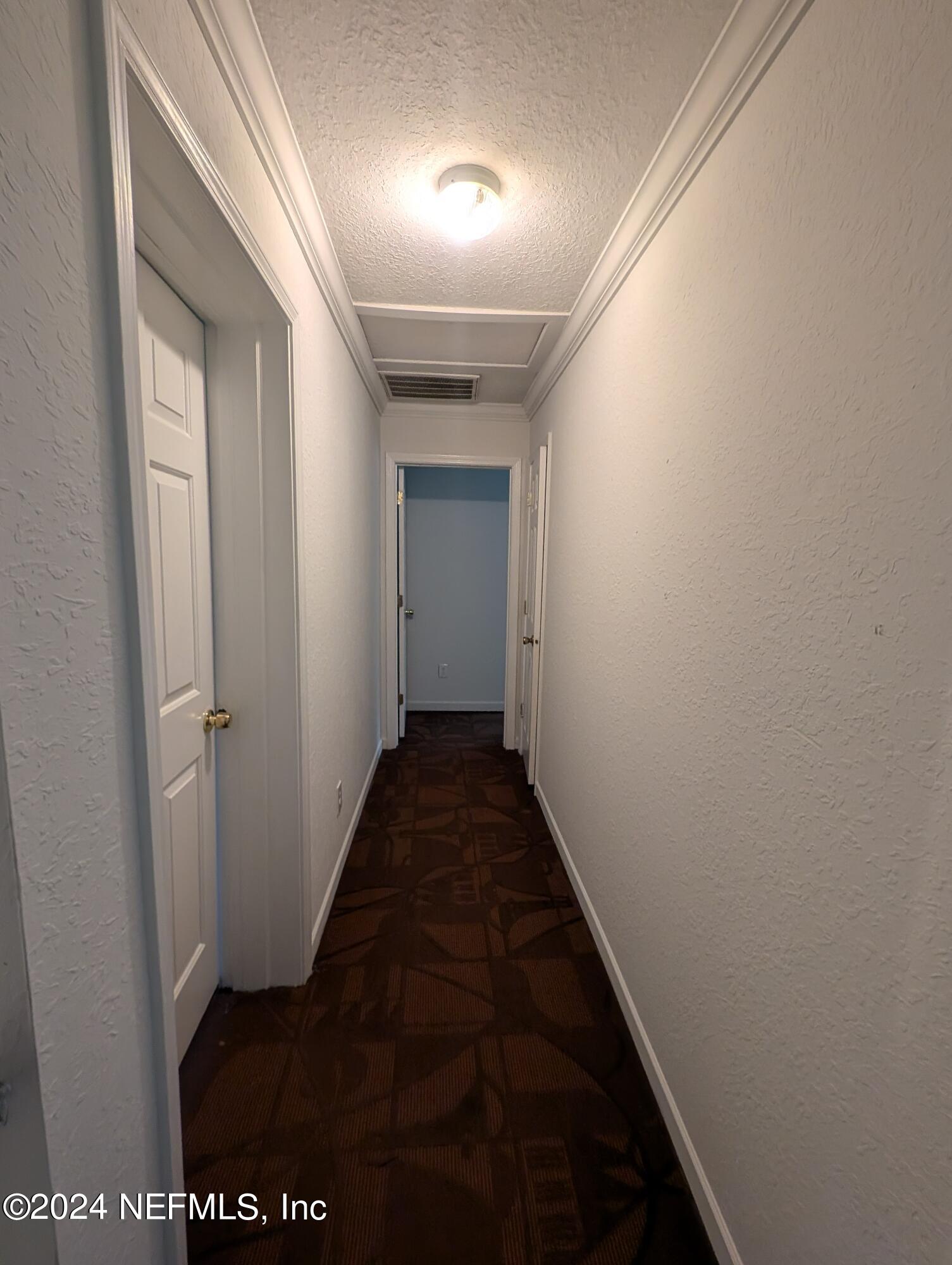 114 Cedar Street, Unit 8 St. Augustine, FL 32084 - Photo 18 of 39 a view of a hallway
