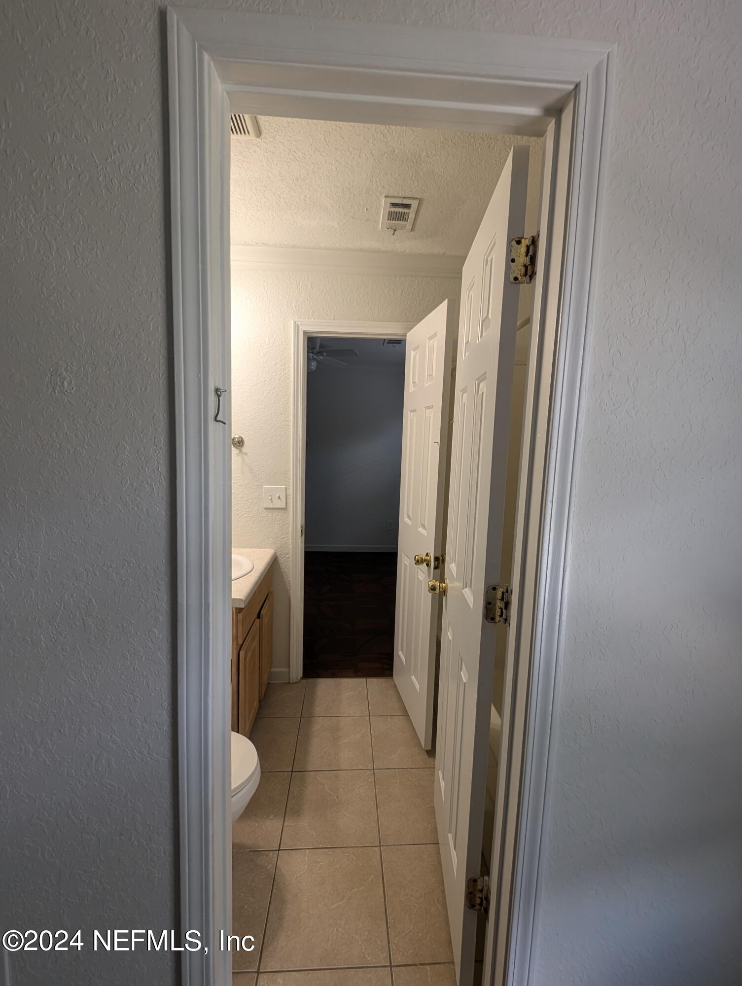 114 Cedar Street, Unit 8 St. Augustine, FL 32084 - Photo 22 of 39 a view of a bathroom from a hallway