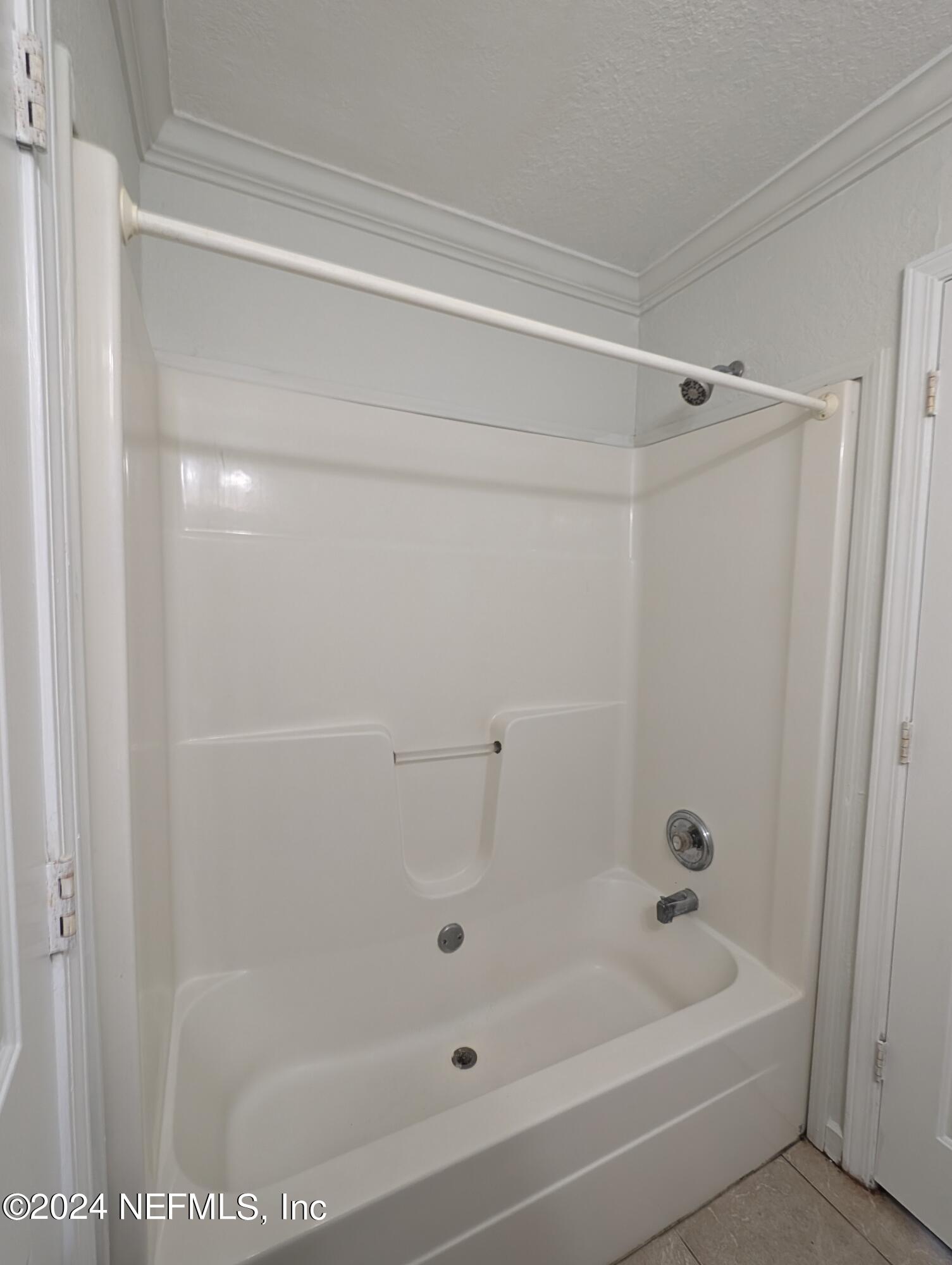 114 Cedar Street, Unit 8 St. Augustine, FL 32084 - Photo 24 of 39 a bathroom with a bathtub