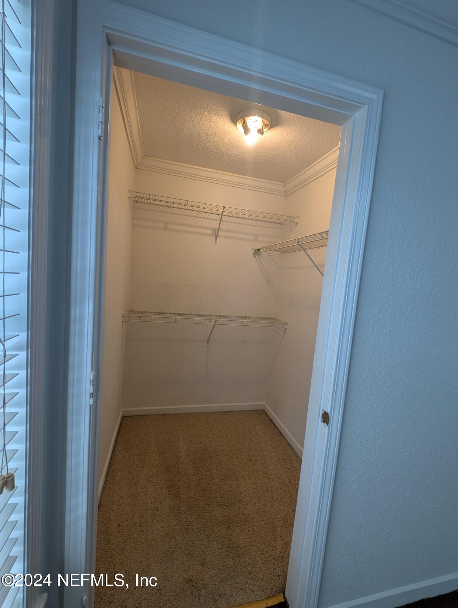 114 Cedar Street, Unit 8 St. Augustine, FL 32084 - Photo 29 of 39 a bathroom with a glass shower door