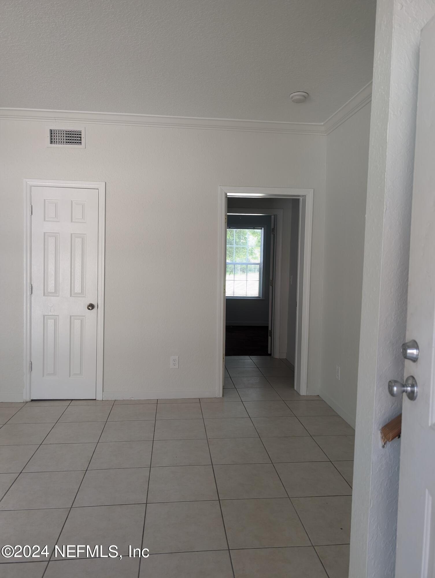 114 Cedar Street, Unit 8 St. Augustine, FL 32084 - Photo 3 of 39 a view of an empty room with a bathroom