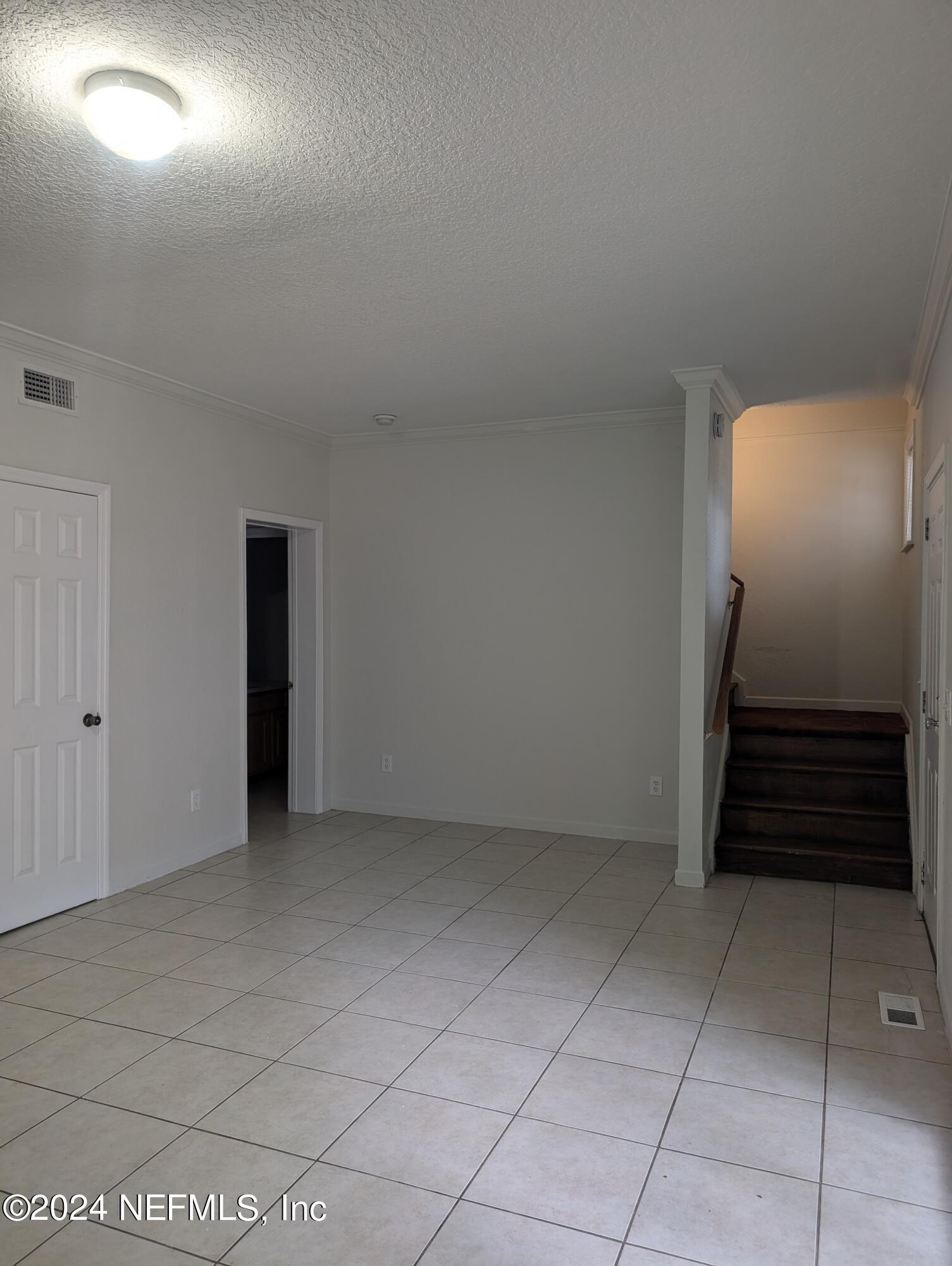 114 Cedar Street, Unit 8 St. Augustine, FL 32084 - Photo 9 of 39 a view of an empty room with a fireplace