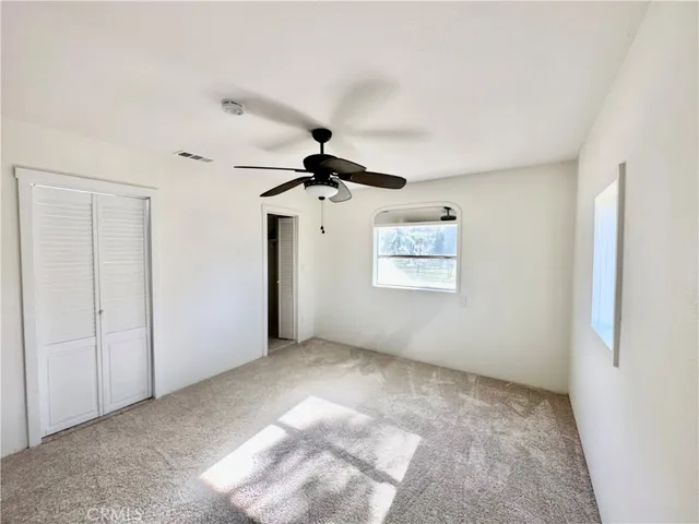 a view of a big room with carpet