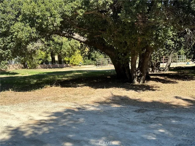 a view of swimming pool with outdoor seating and lake