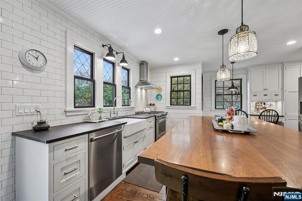 54 Joyce Road Tenafly, NJ 07670 - Photo 14 of 35 a kitchen with sink cabinets and window