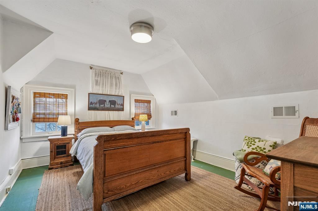 54 Joyce Road Tenafly, NJ 07670 - Photo 27 of 35 a bedroom with a bed and wooden floor