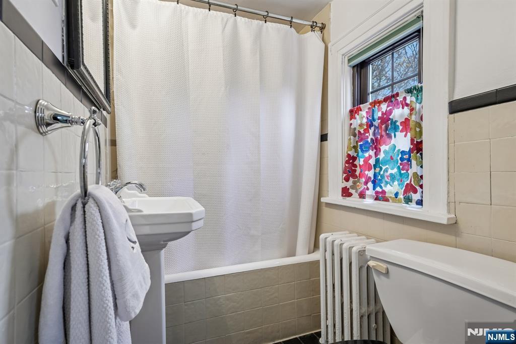 54 Joyce Road Tenafly, NJ 07670 - Photo 28 of 35 a bathroom with a bathtub and shower