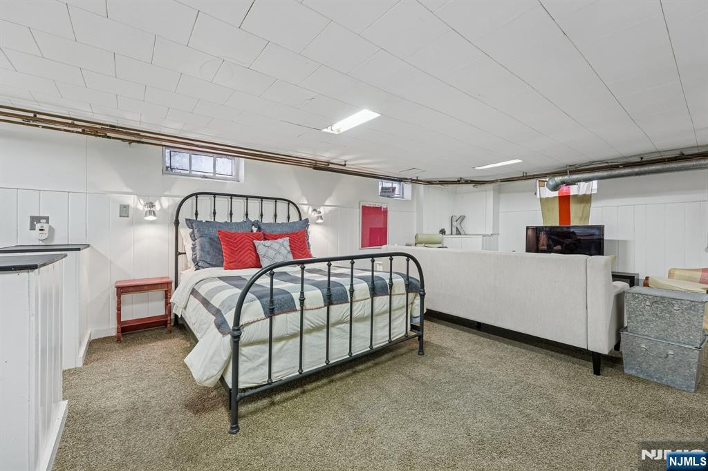 54 Joyce Road Tenafly, NJ 07670 - Photo 32 of 35 a bedroom with a bed and a couch