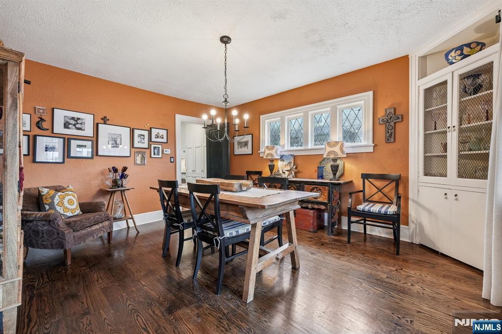 54 Joyce Road Tenafly, NJ 07670 - Photo 8 of 35 a view of a dining room with furniture window and wooden floor