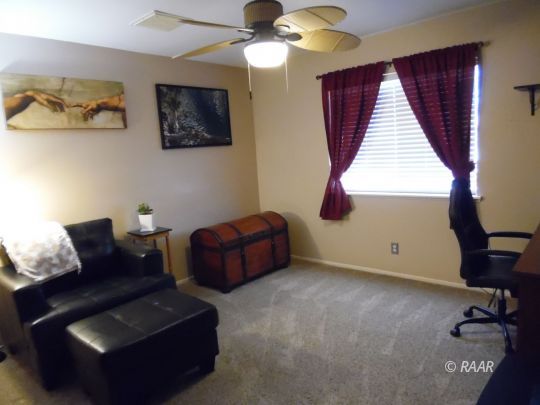 417 Mavis Court Ridgecrest, CA 93555 - Photo 18 of 31 a living room with furniture and a window