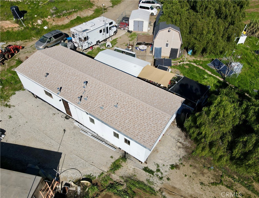 25099 Bundy Canyon Road Menifee, CA 92584 - Photo 14 of 16 an aerial view of a house with a yard and pool