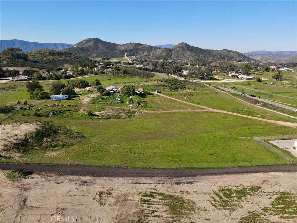 25099 Bundy Canyon Road Menifee, CA 92584 - Photo 9 of 16 a view of a lake with a mountain in the background