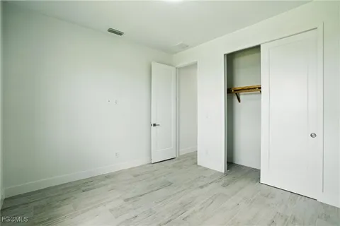 a bathroom with a double vanity sink mirror and shower