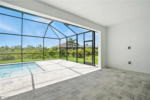 a view of a backyard with a swimming pool