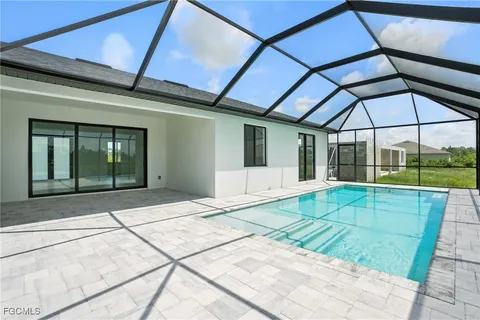 a view of an empty room with a floor to ceiling windows