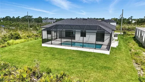 a view of house with garden space and street view