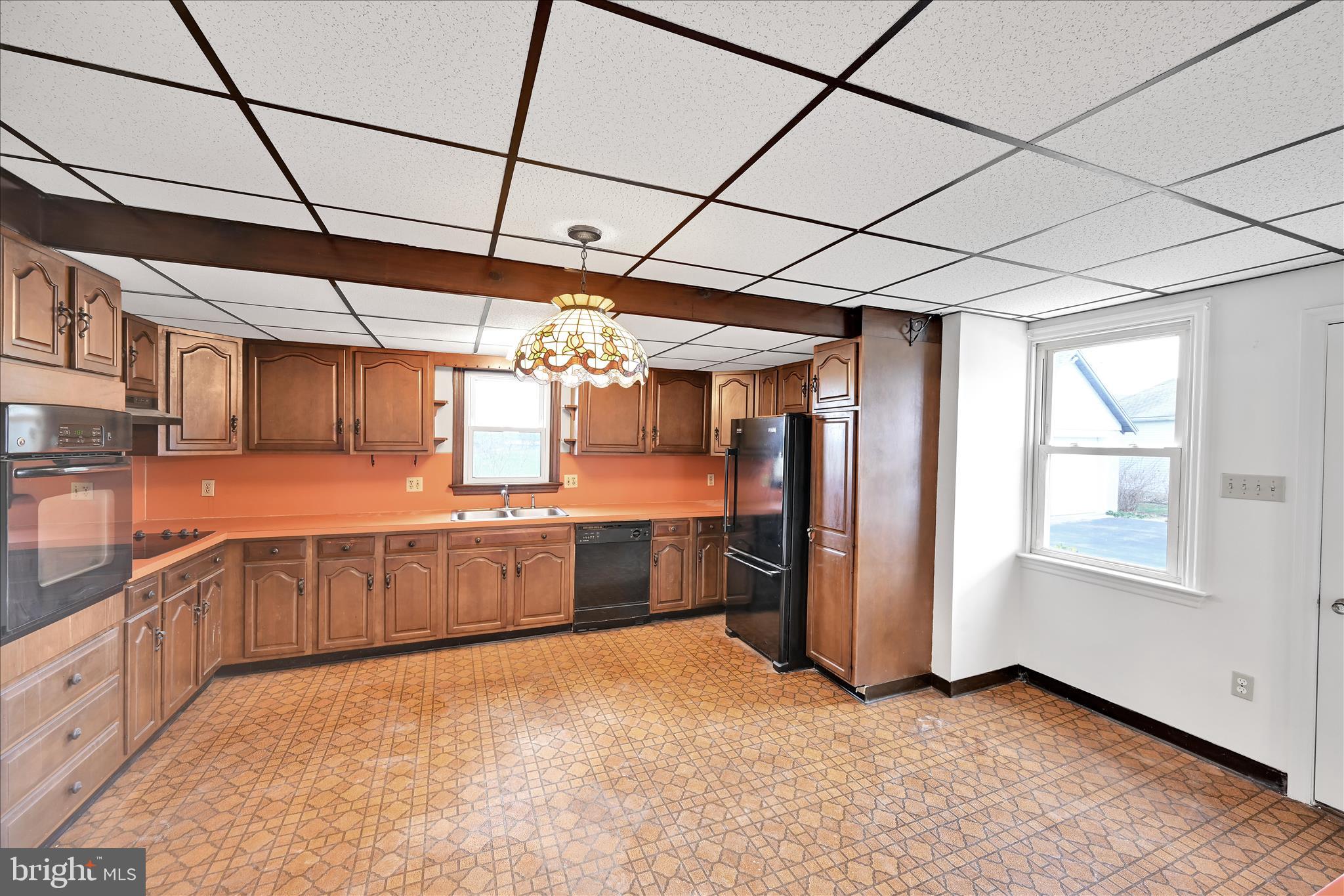 1211 River Road Quarryville, PA 17566 - Photo 15 of 33 a large kitchen with a large window and stainless steel appliances