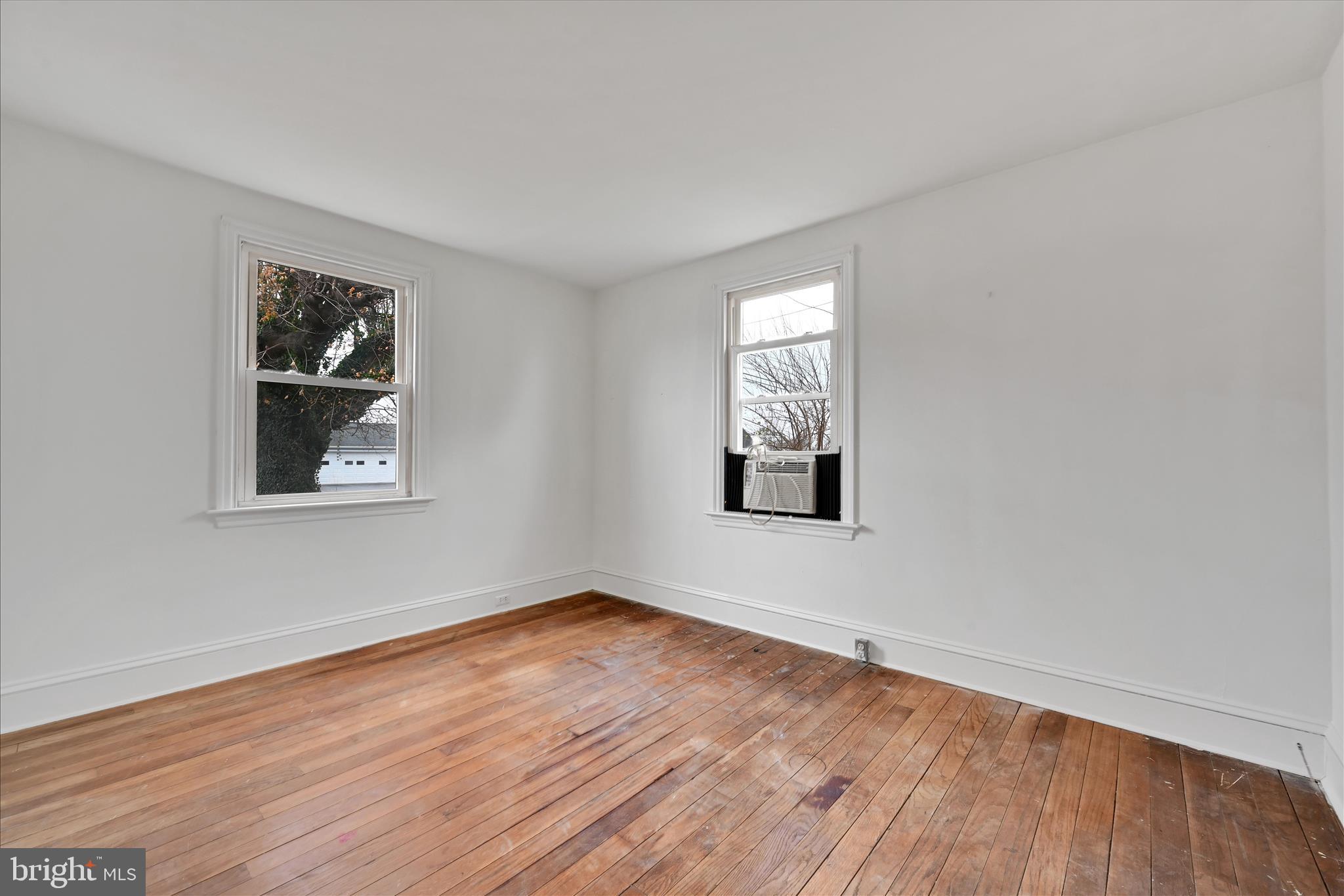 1211 River Road Quarryville, PA 17566 - Photo 17 of 33 a view of an empty room with wooden floor and a window