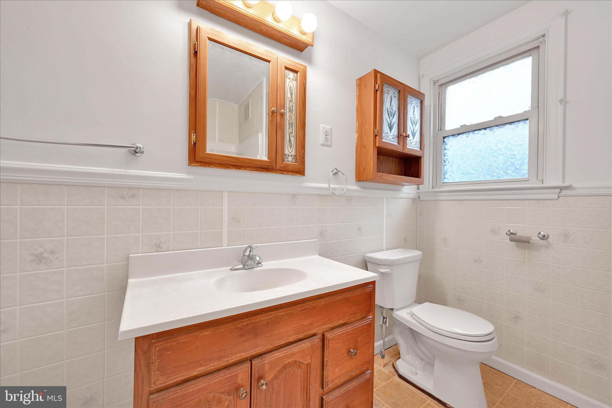 1211 River Road Quarryville, PA 17566 - Photo 19 of 33 a bathroom with a sink a toilet and a mirror
