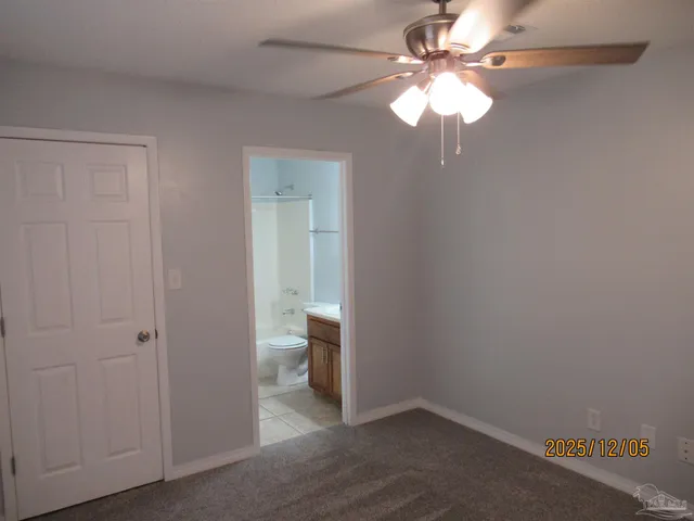 a white toilet sitting next to a bath tub