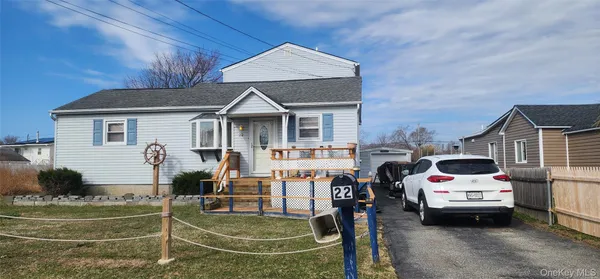 a dining room with furniture and chandelier