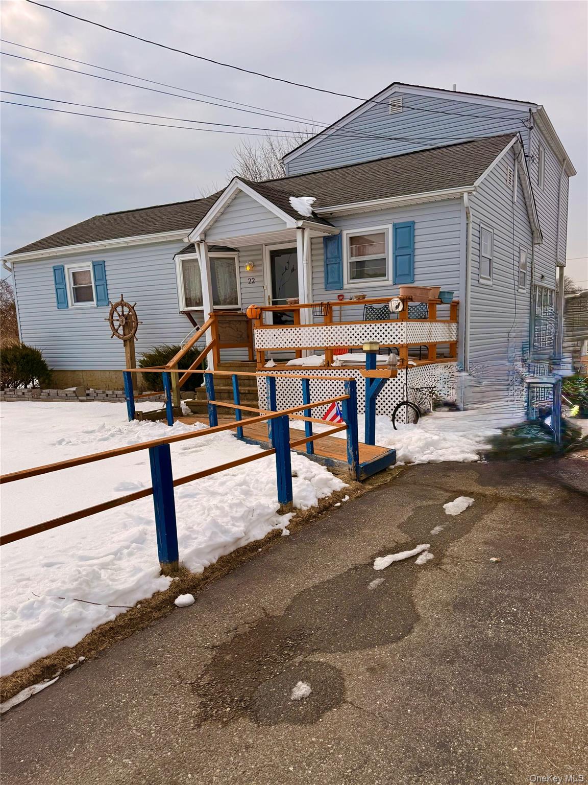 22 Blue Point Road Mastic Beach, NY 11951 - Photo 2 of 29 a view of a house with a patio