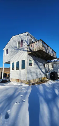 a view of a hallway with washer and dryer