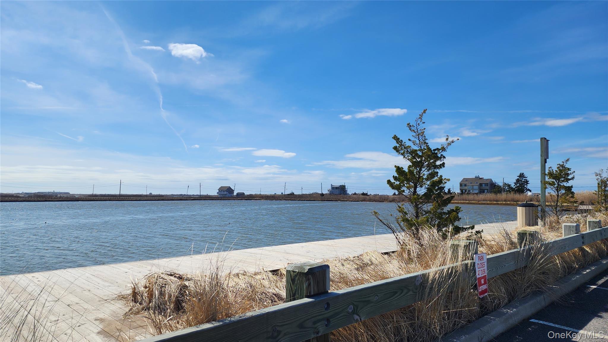 22 Blue Point Road Mastic Beach, NY 11951 - Photo 28 of 29 a view of a lake with a outdoor space