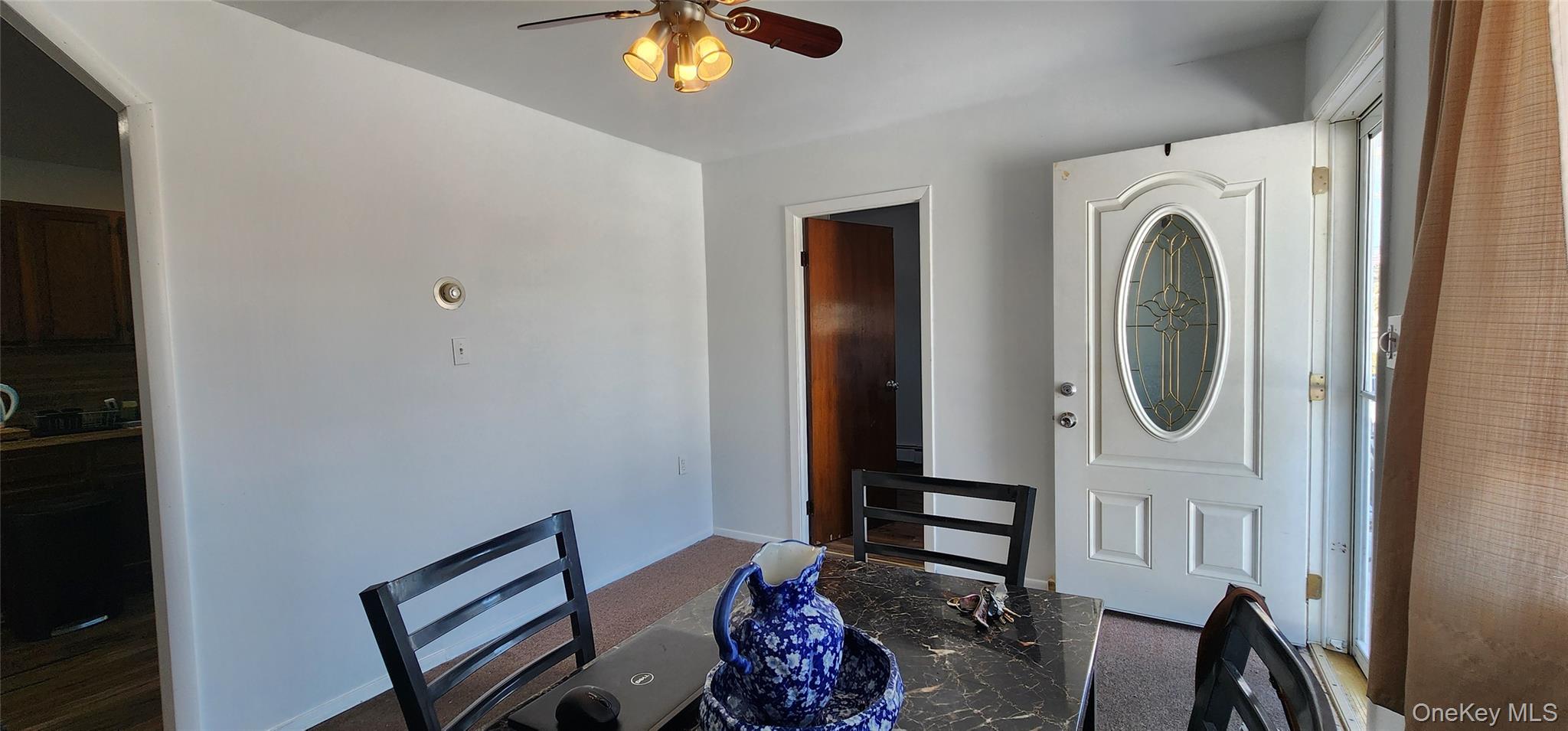 22 Blue Point Road Mastic Beach, NY 11951 - Photo 4 of 23 a view of a hallway with washer and dryer