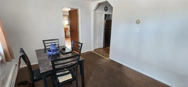 a kitchen with a sink a refrigerator and cabinets