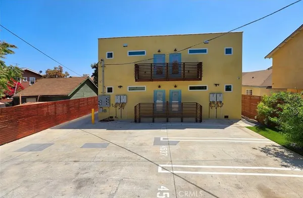 a view of a house with backyard and patio