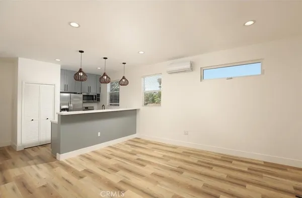 a kitchen with granite countertop a stove and a refrigerator