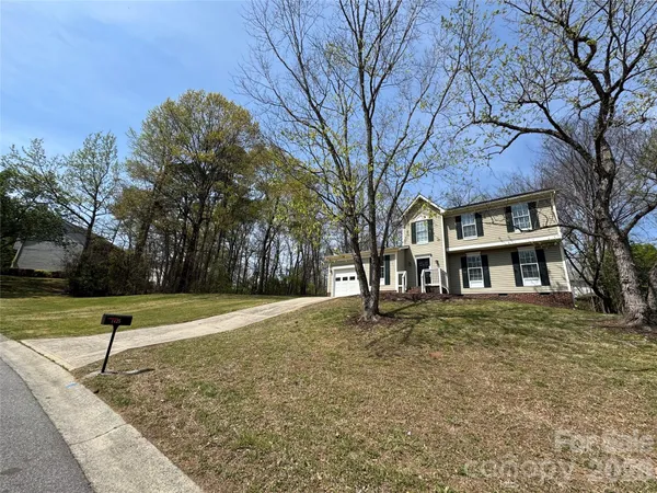a house with trees in the background