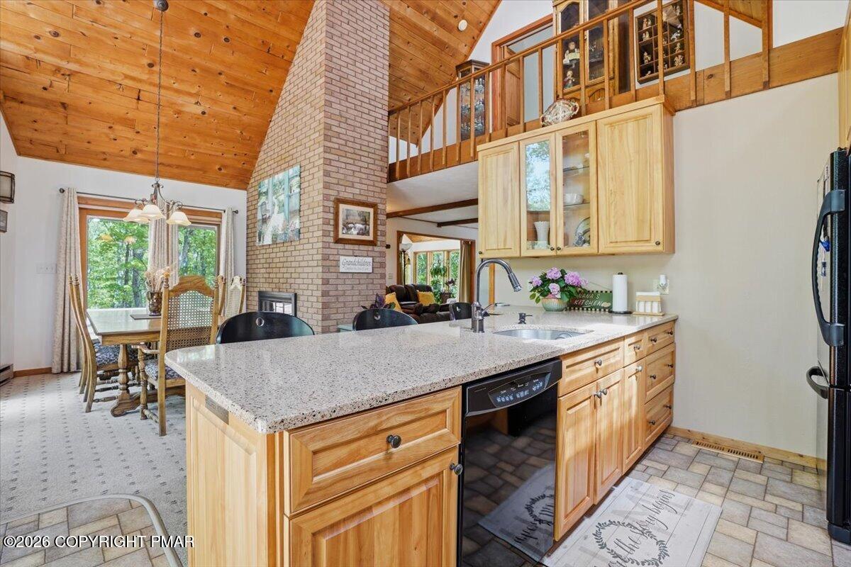 1517 Deer Run East Bushkill, PA 18324 - Photo 19 of 42 a kitchen with stainless steel appliances granite countertop a stove and a sink