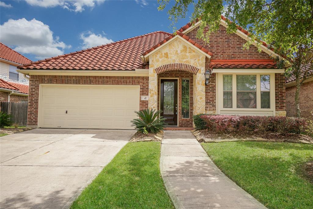 Welcome home to 47 Cherry Hills! This stunning Mediterranean style home has great curb appeal and located in the desirable Lakes of Jersey Village Community. Just minutes from the renowned Jersey Meadows Golf Course!
