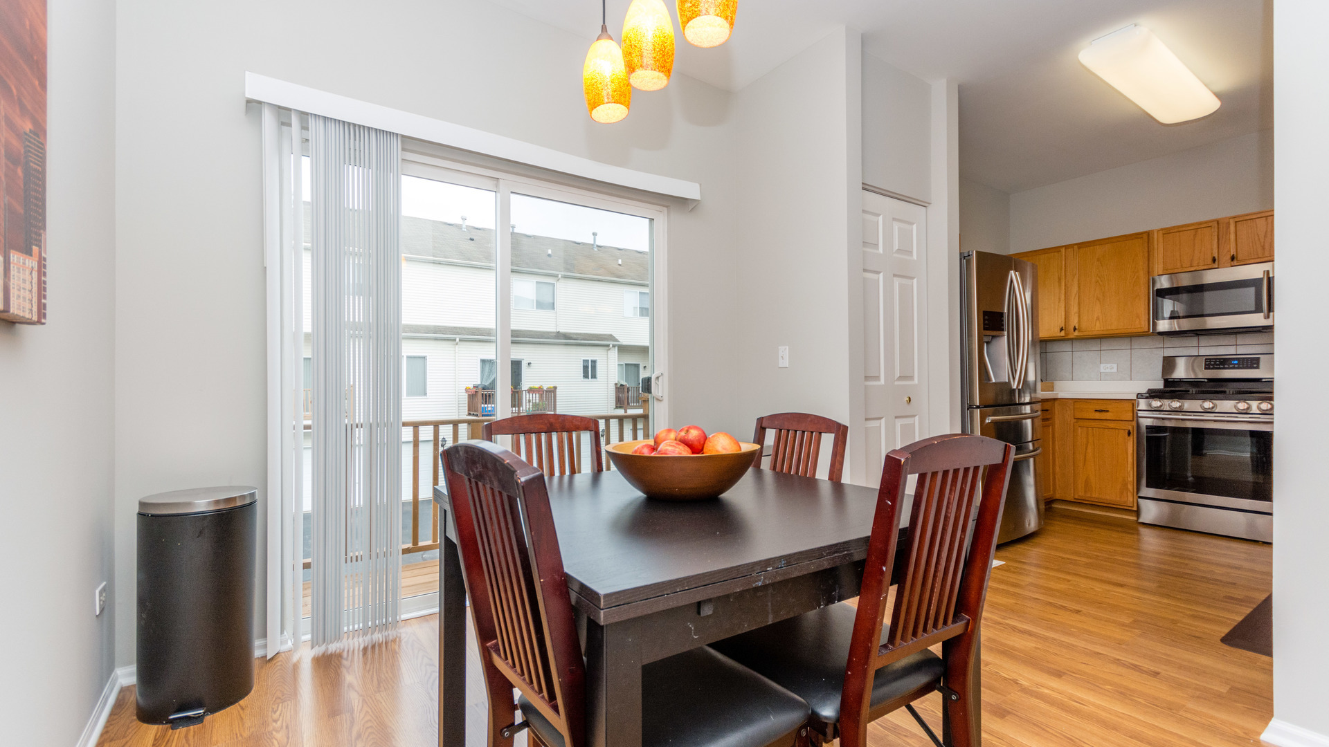 141 Enclave Circle, Unit B Bolingbrook, IL 60440 - Photo 17 of 41 a view of a dining room with furniture and wooden floor
