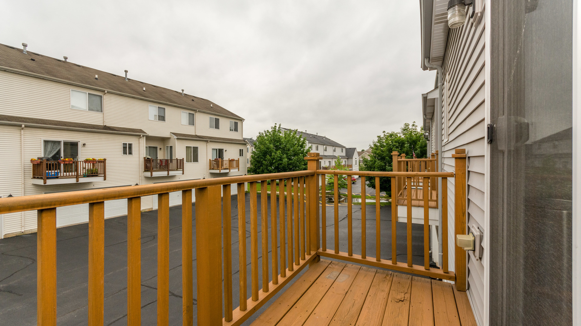 141 Enclave Circle, Unit B Bolingbrook, IL 60440 - Photo 21 of 41 a view of a balcony with wooden floor