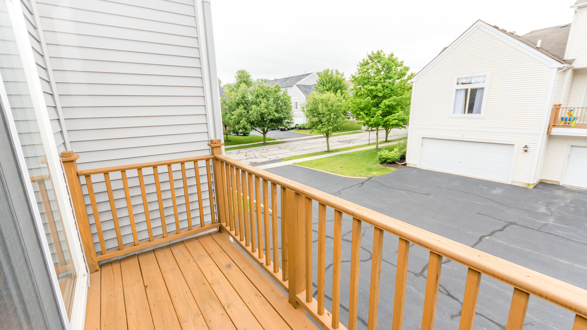 141 Enclave Circle, Unit B Bolingbrook, IL 60440 - Photo 22 of 41 a view of a balcony with wooden floor