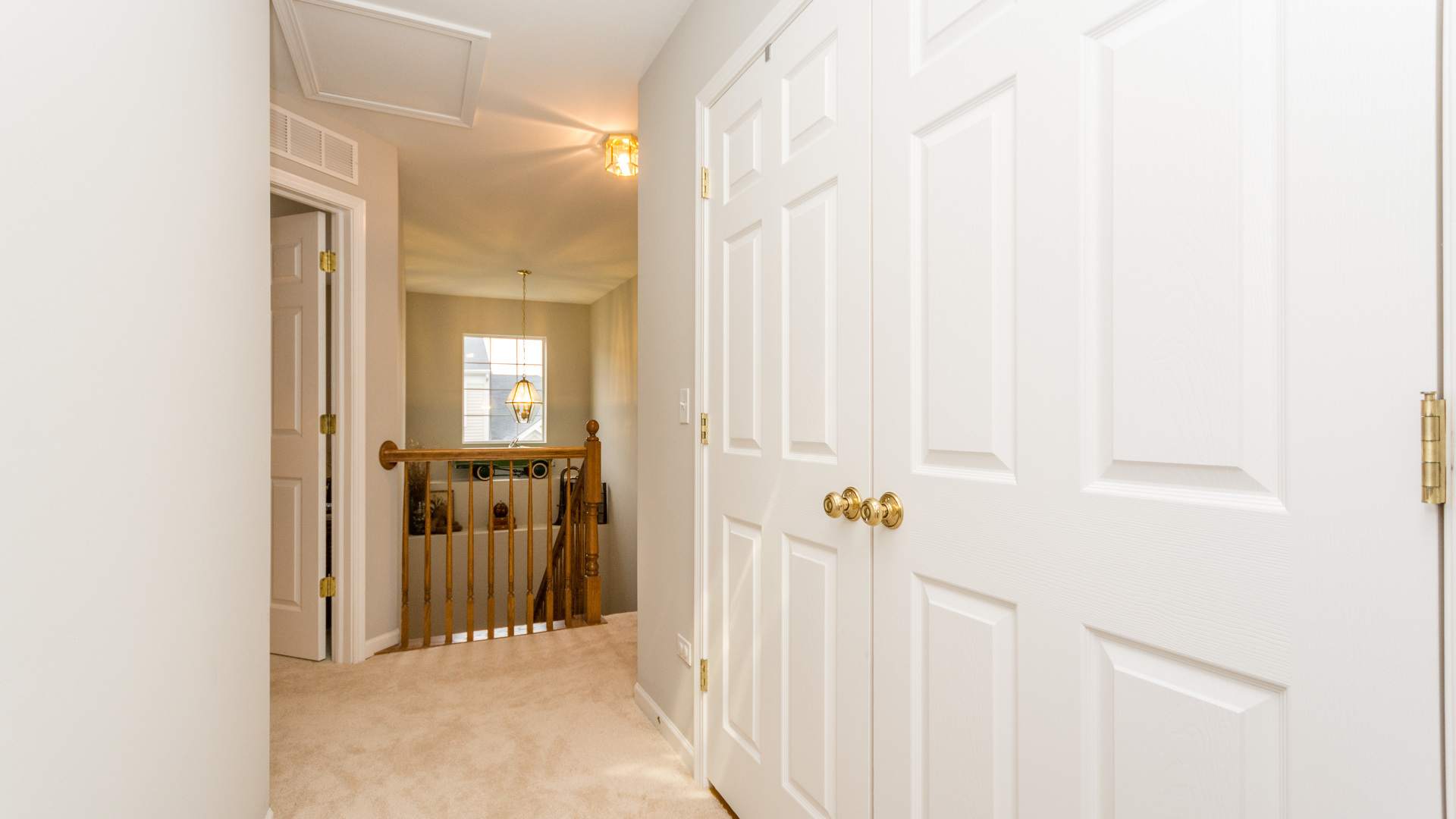 141 Enclave Circle, Unit B Bolingbrook, IL 60440 - Photo 25 of 41 a view of a hallway with a window and a yard