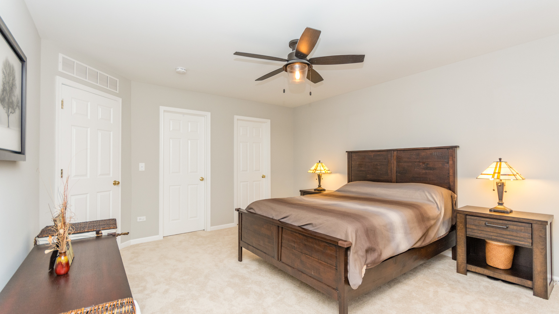 141 Enclave Circle, Unit B Bolingbrook, IL 60440 - Photo 27 of 41 a bed room with a bed and a ceiling fan
