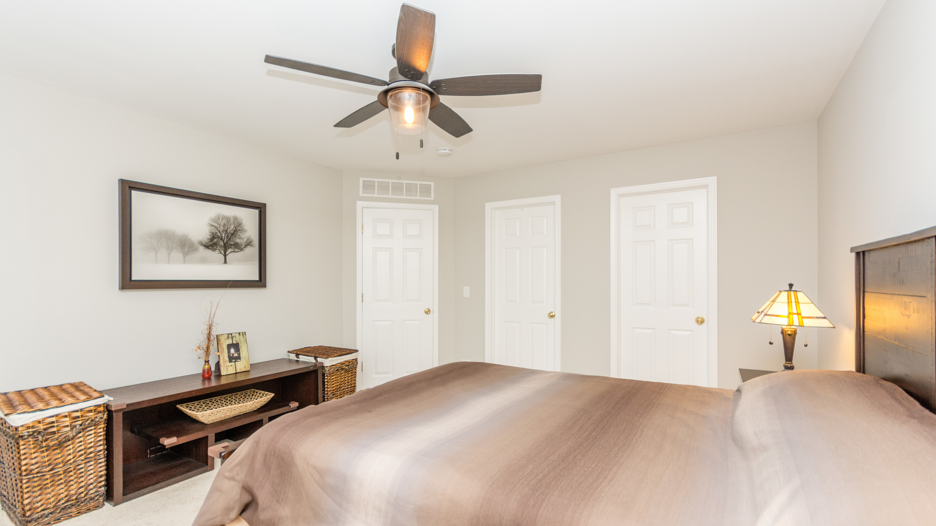 141 Enclave Circle, Unit B Bolingbrook, IL 60440 - Photo 28 of 41 a bedroom with a bed and a chandelier