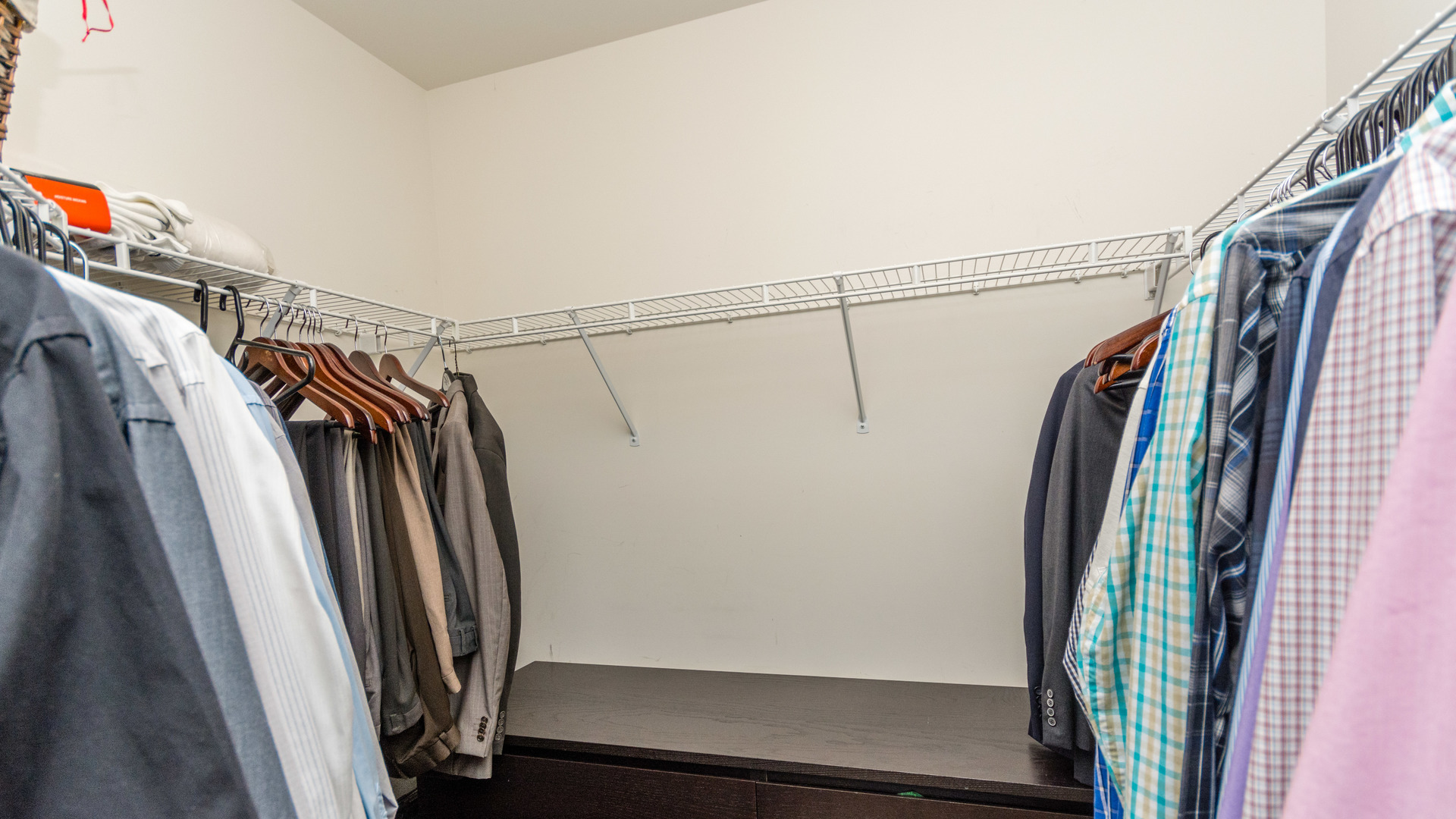 141 Enclave Circle, Unit B Bolingbrook, IL 60440 - Photo 29 of 41 a view of walk in closet with clothes and shoes