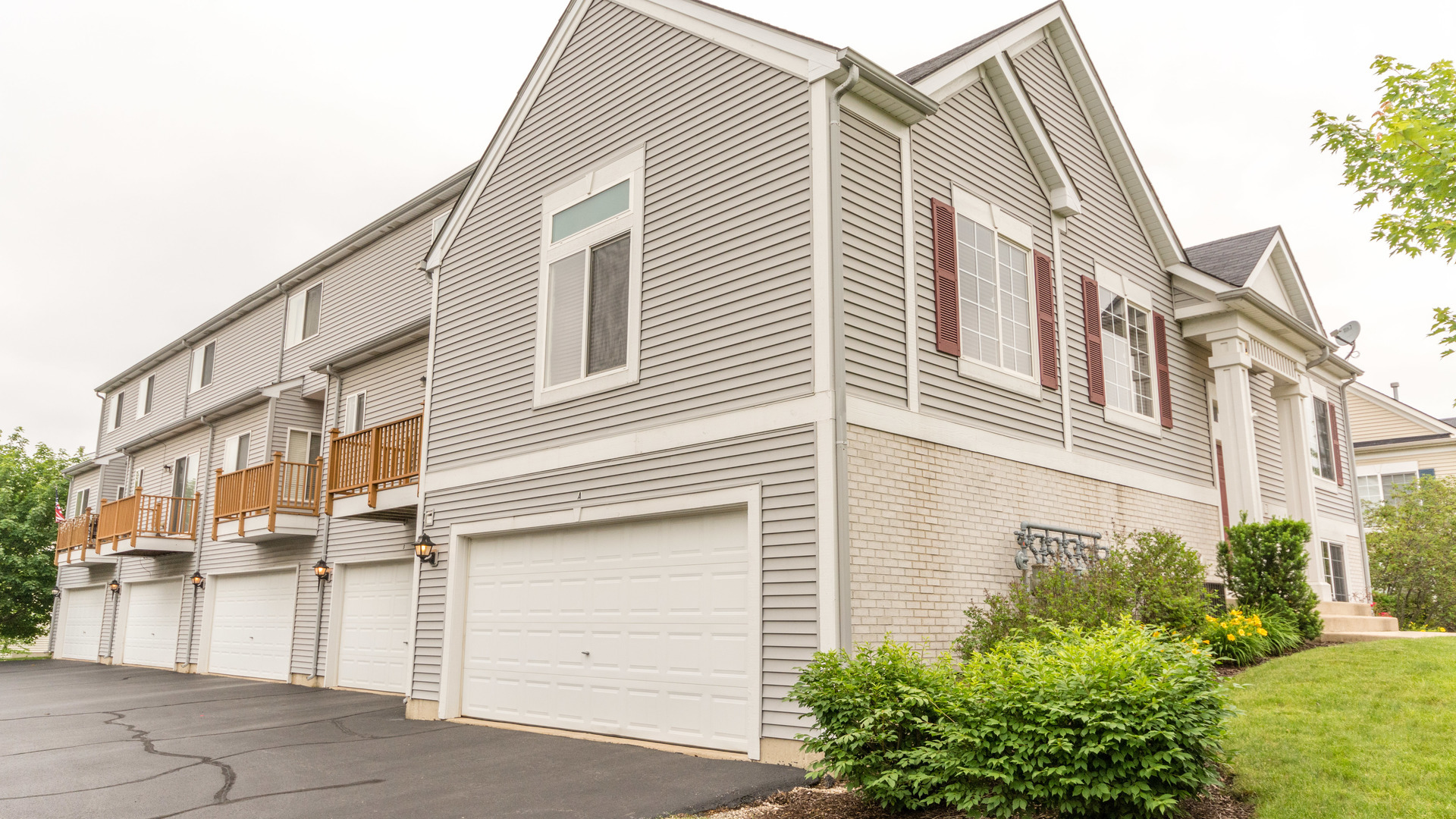 141 Enclave Circle, Unit B Bolingbrook, IL 60440 - Photo 3 of 41 a view of a house with a garage